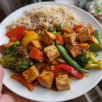 High-Protein Tofu Veggie Stir-Fry — Tofu sautéed with crunchy vegetables and soy-ginger sauce.