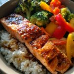 Honey Garlic High-Protein Salmon Bowl — Salmon with garlic glaze over rice and vegetables.