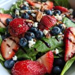 30-Minute Strawberry Spinach Salad with Blueberries, Pecans, Feta cheese, and a Balsamic glaze.