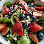 30-Minute Strawberry Spinach Salad with Blueberries, Pecans, Feta cheese, and a Balsamic glaze.